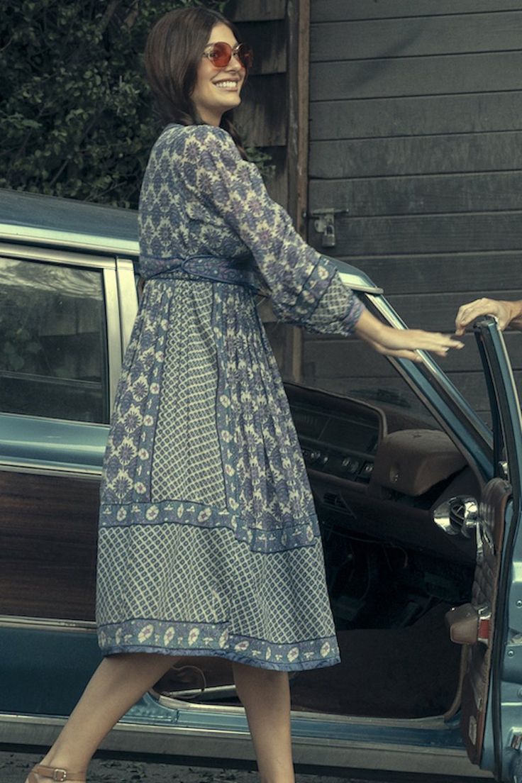 Camila Dunne in blue peasant dress.